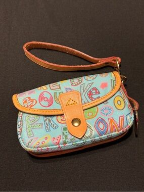 A Dooney and Bourke Colorful Patterned Vintage Wristlet with Tan Leather Trim